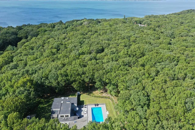 an aerial view of a house with a yard