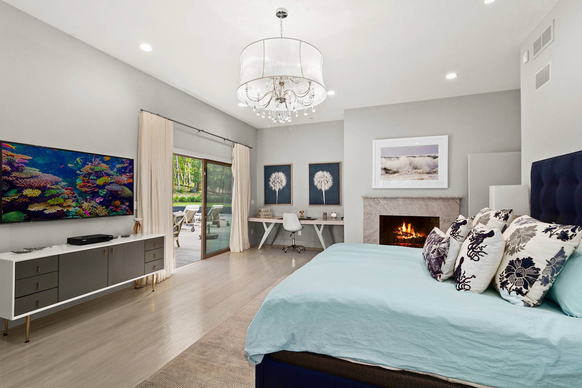 1705 Noyack Road Southampton, NY 11968 - Photo 9 of 16 a bedroom with furniture and a fireplace