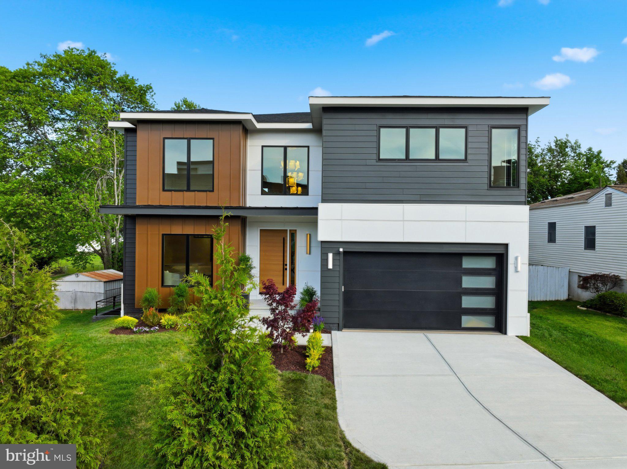 7421 Magarity Road Falls Church, VA 22043 - Photo 2 of 66 Modern elegance meets vibrant greenery.