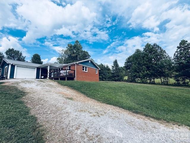 54 Dee Cable Drive Marion, NC 28752 - Photo 13 of 16 a front view of a house with a yard