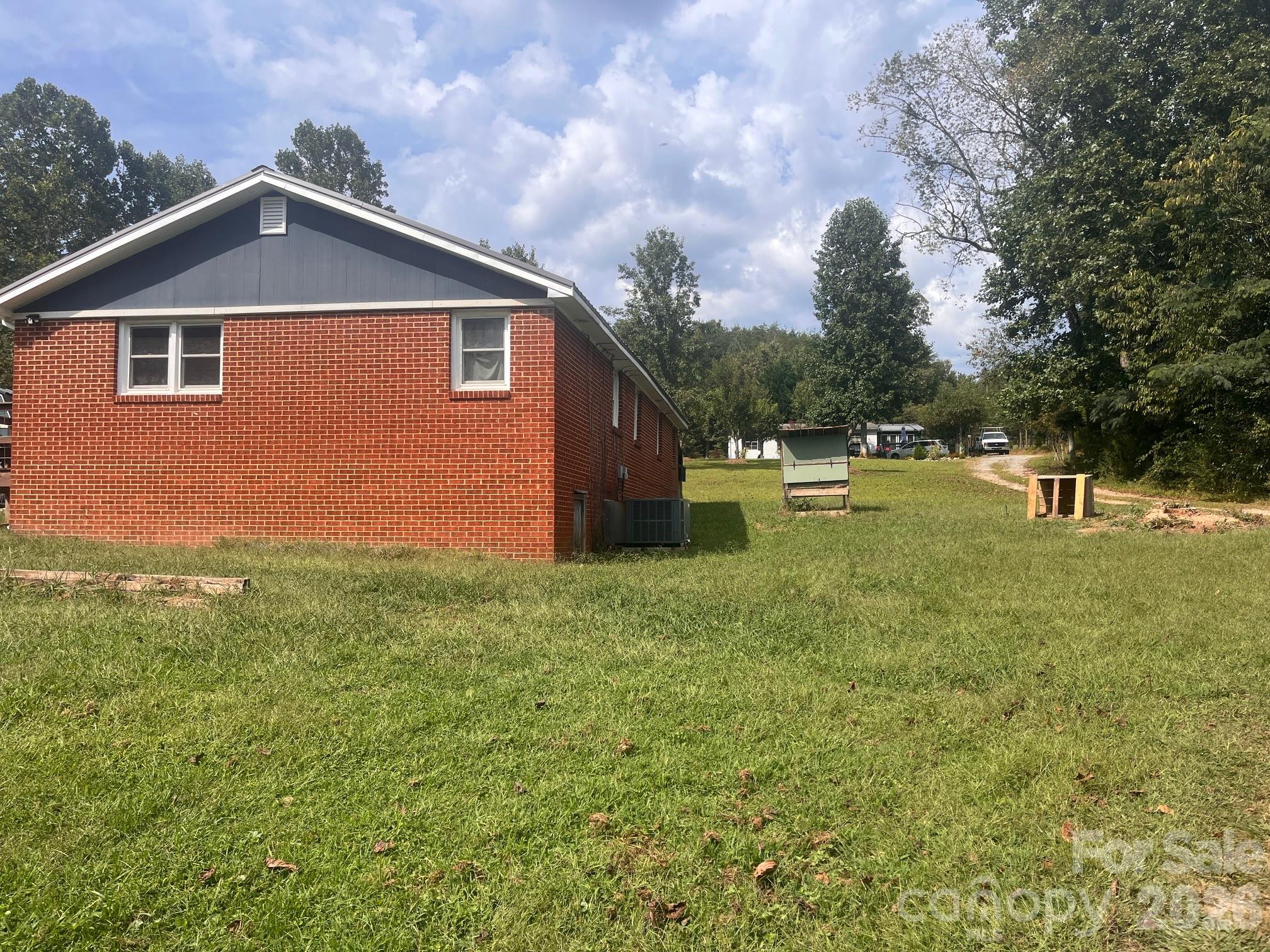54 Dee Cable Drive Marion, NC 28752 - Photo 16 of 16 a backyard of a house with table and chairs
