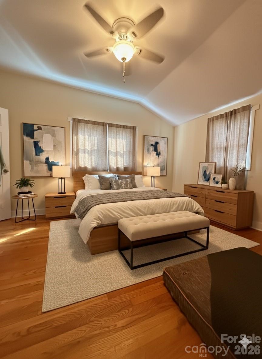 54 Dee Cable Drive Marion, NC 28752 - Photo 10 of 16 a spacious bedroom with a bed a window and a couch