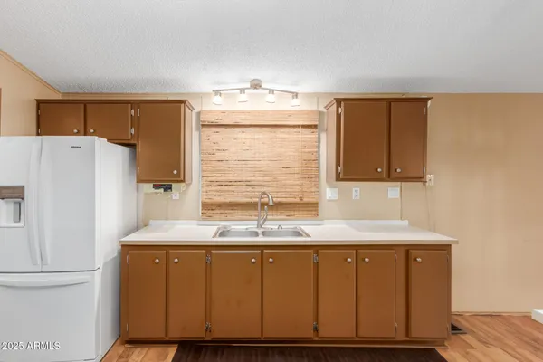 a bathroom with a sink a mirror and a shower