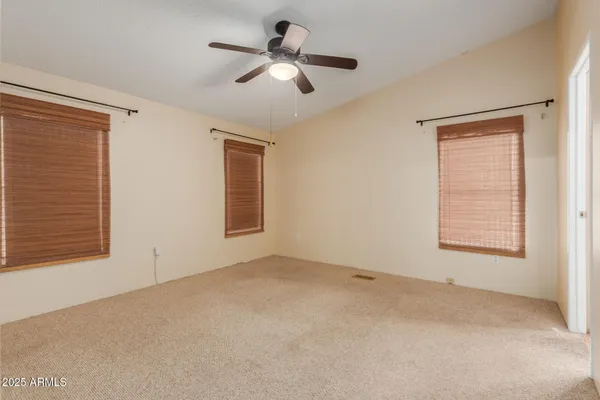 a view of an empty room with a window