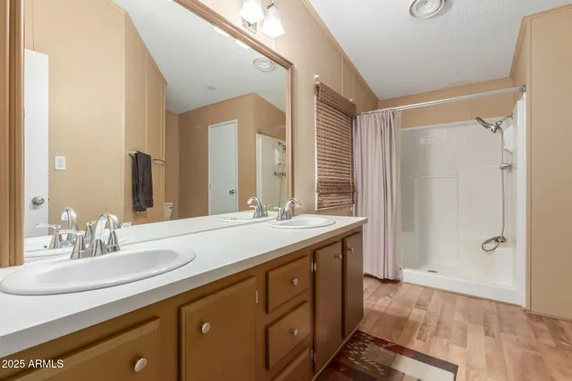 a bathroom with a double vanity sink mirror and double