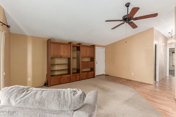 a view of a livingroom with a furniture and closet