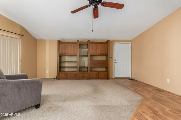 a view of an empty room with a cabinet