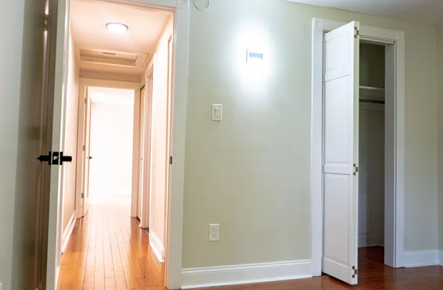 a view of a bathroom from a corridor