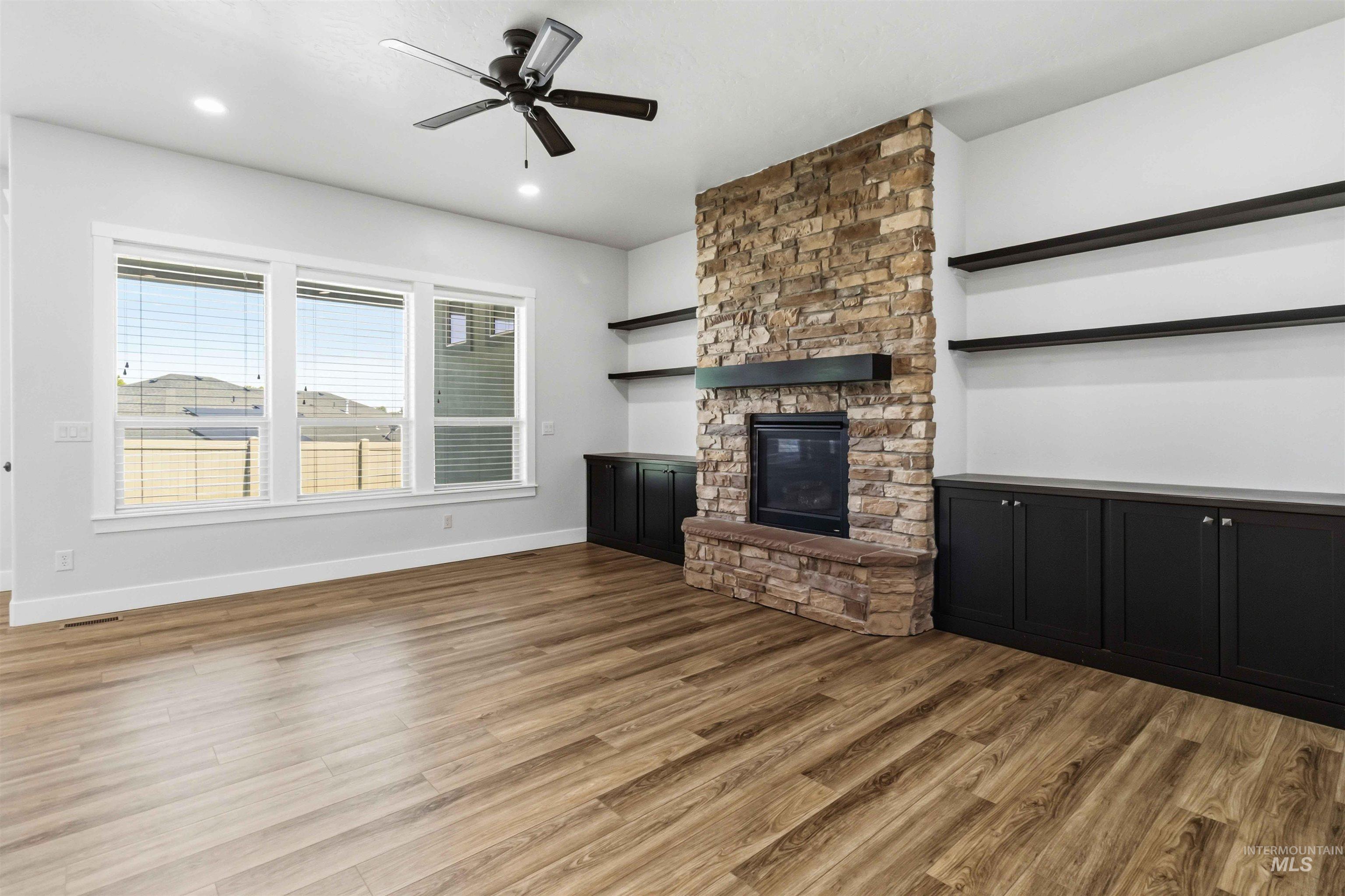 3218 North Cherry Laurel Way Star, ID 83669 - Photo 19 of 50 Carpeted room with a tray ceiling featuring exposed wood beams and a ceiling fan