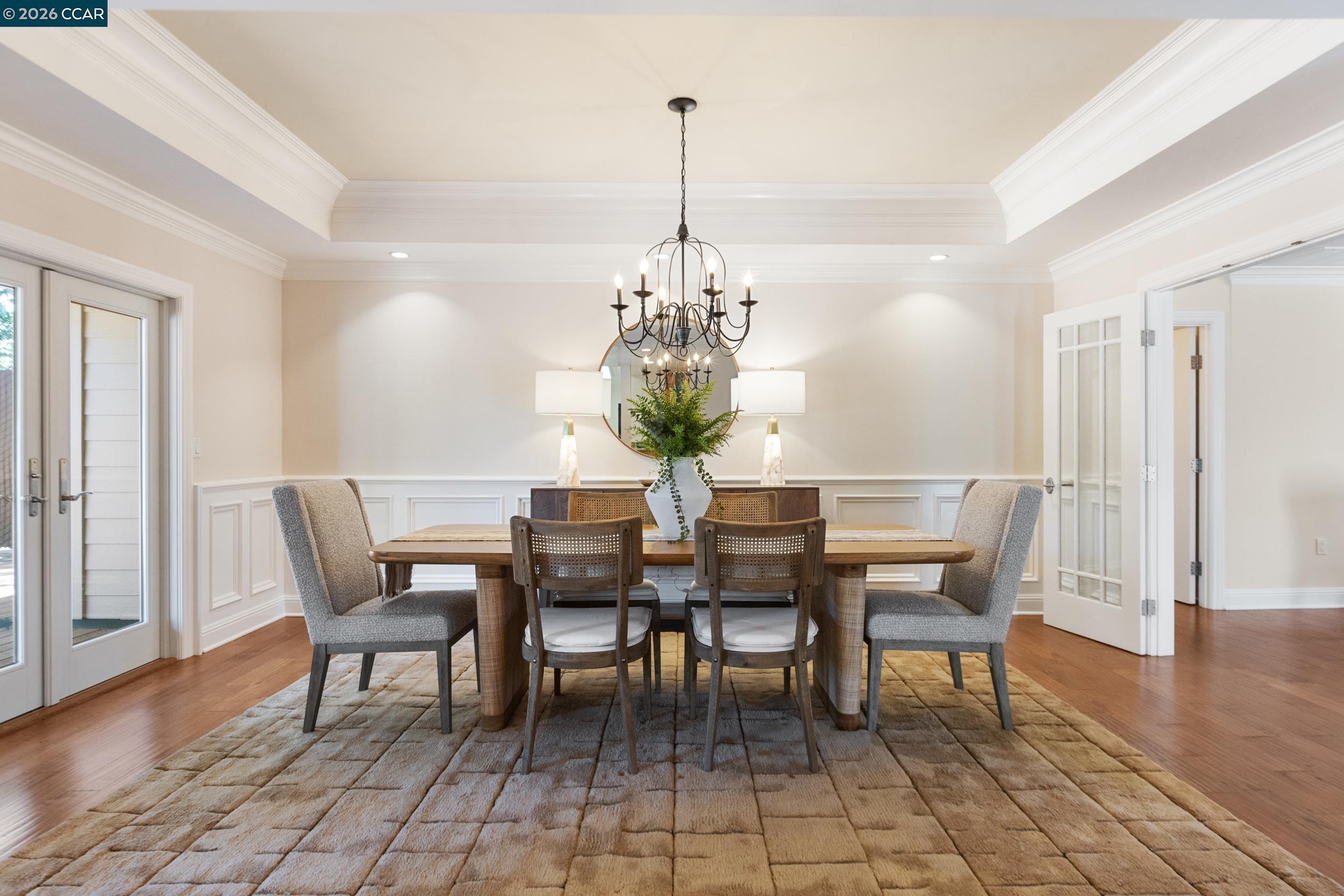 484 Diablo Road Danville, CA 94526 - Photo 12 of 39 a dining room with furniture a chandelier and wooden floor