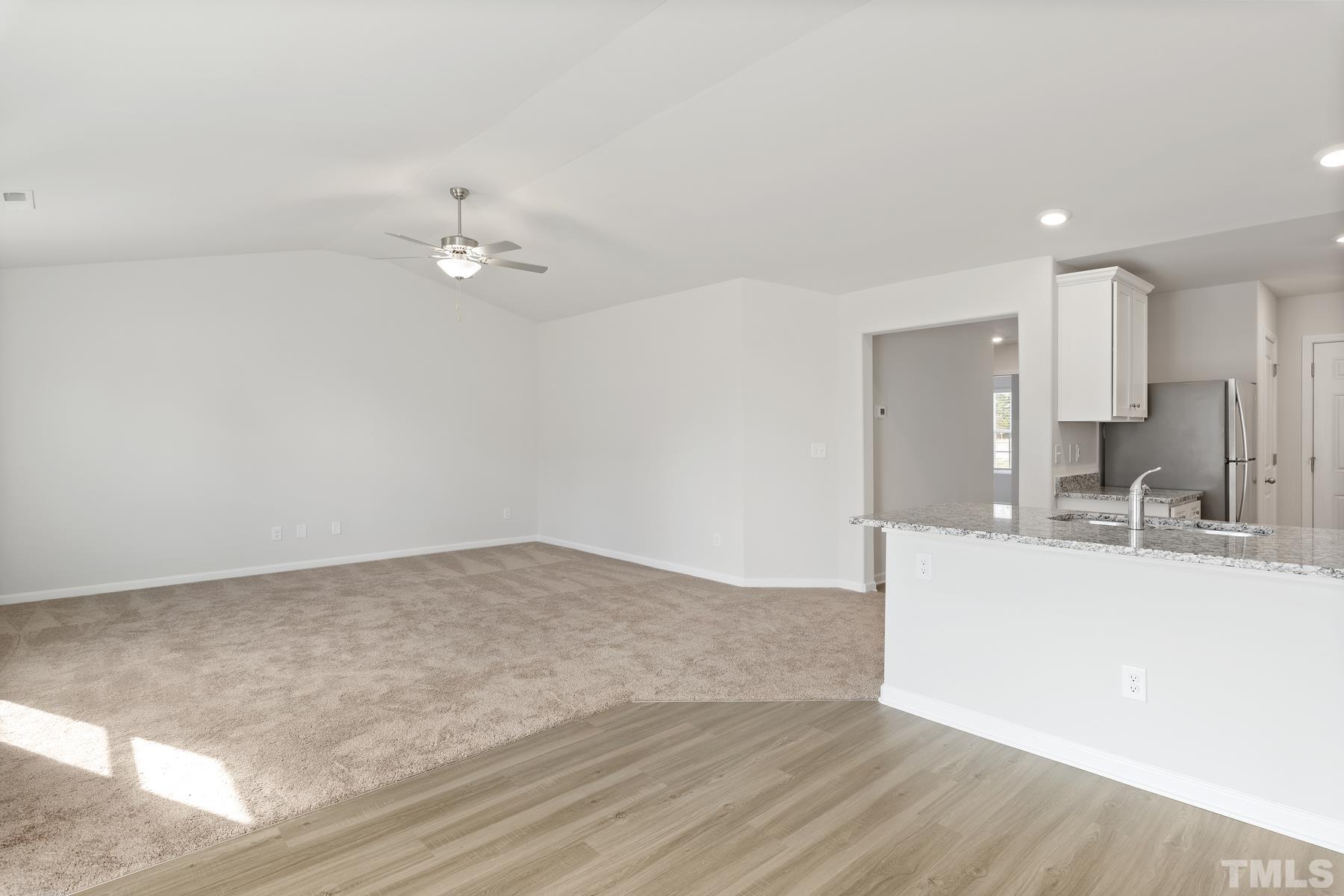 470 Crow Field Street Roxboro, NC 27574 - Photo 12 of 17 a view of a kitchen with a sink and a chandelier