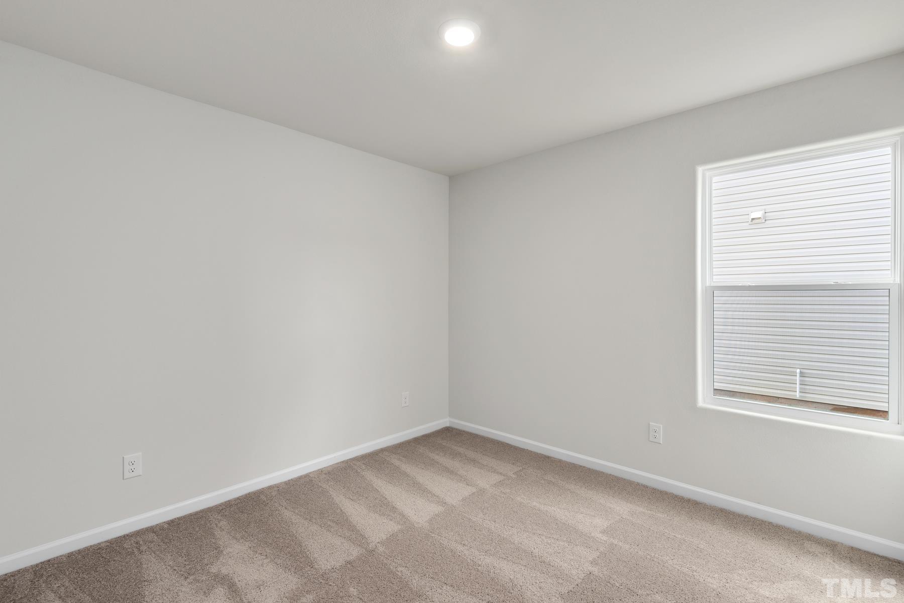 470 Crow Field Street Roxboro, NC 27574 - Photo 15 of 17 an empty room with a window