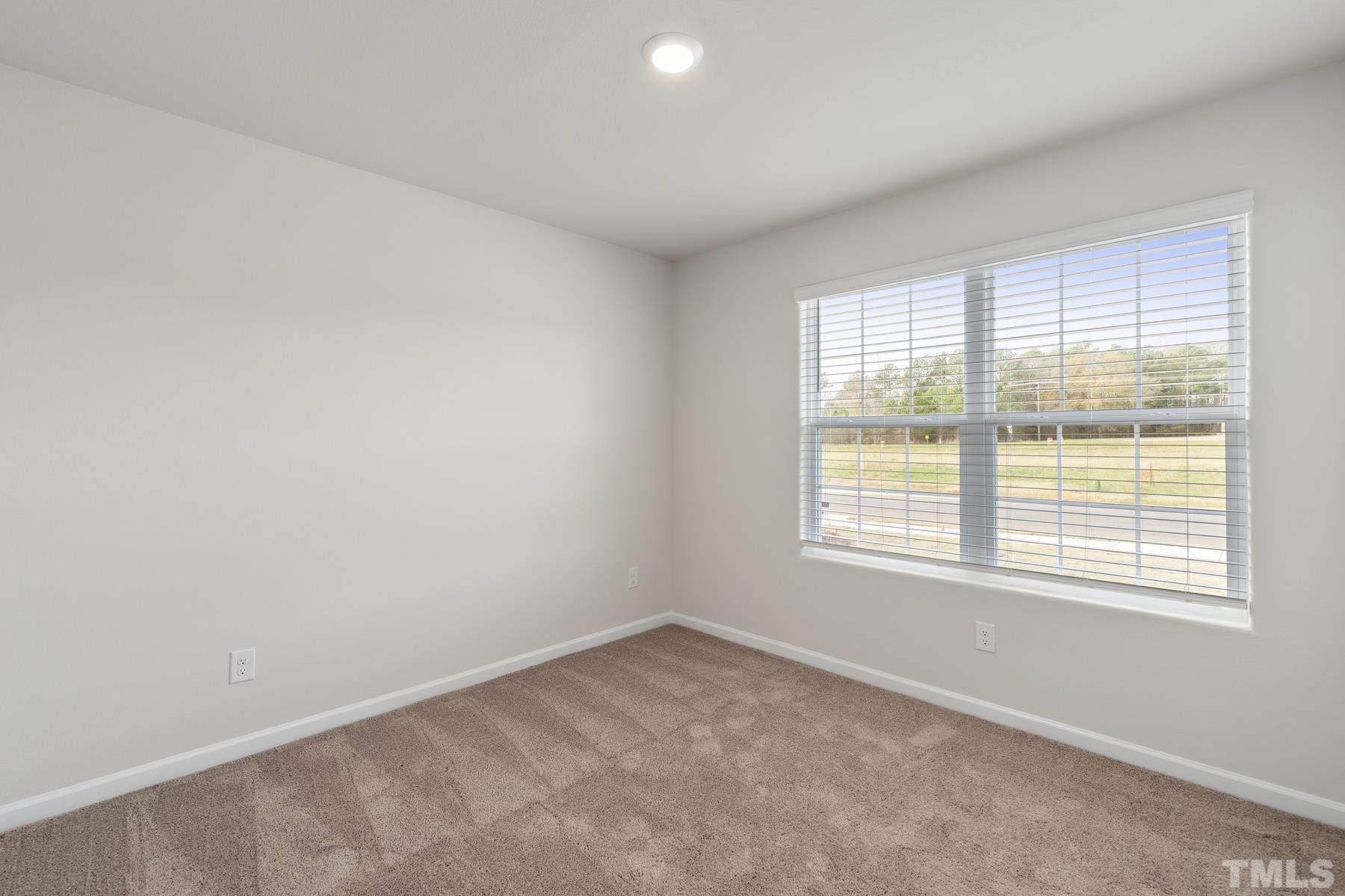 470 Crow Field Street Roxboro, NC 27574 - Photo 16 of 17 an empty room with a window