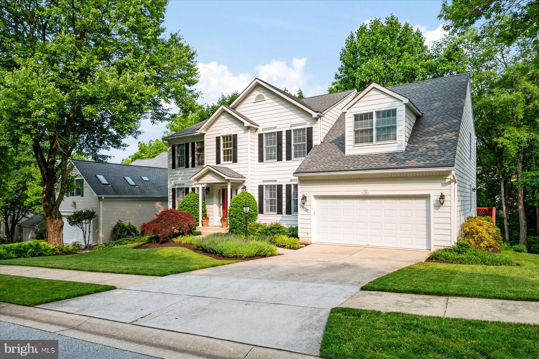 6008 Winter Grain Path Clarksville, MD 21029 - Photo 2 of 53 a front view of a house with a yard and garage