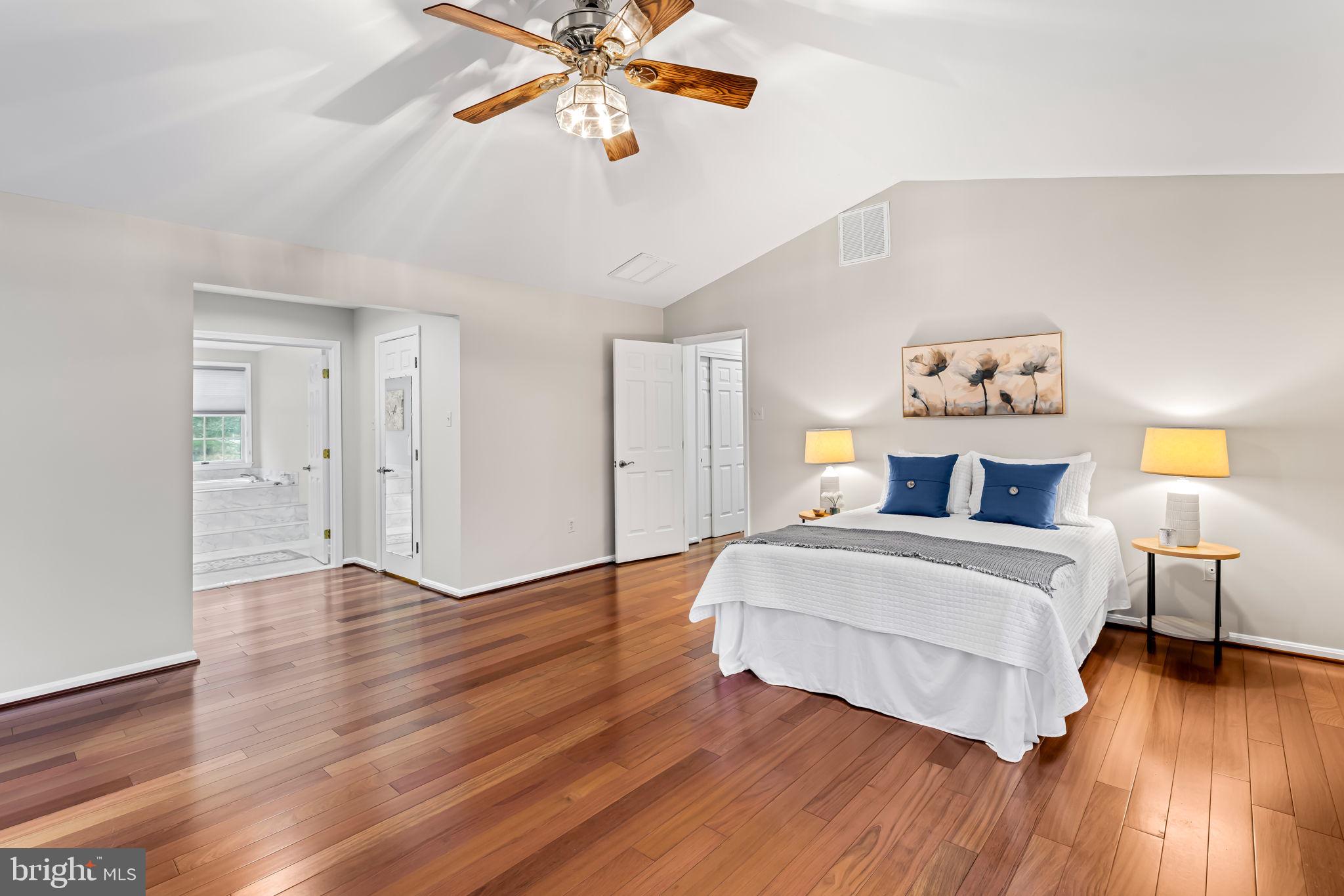 6008 Winter Grain Path Clarksville, MD 21029 - Photo 24 of 53 a spacious bedroom with a bed and wooden floor