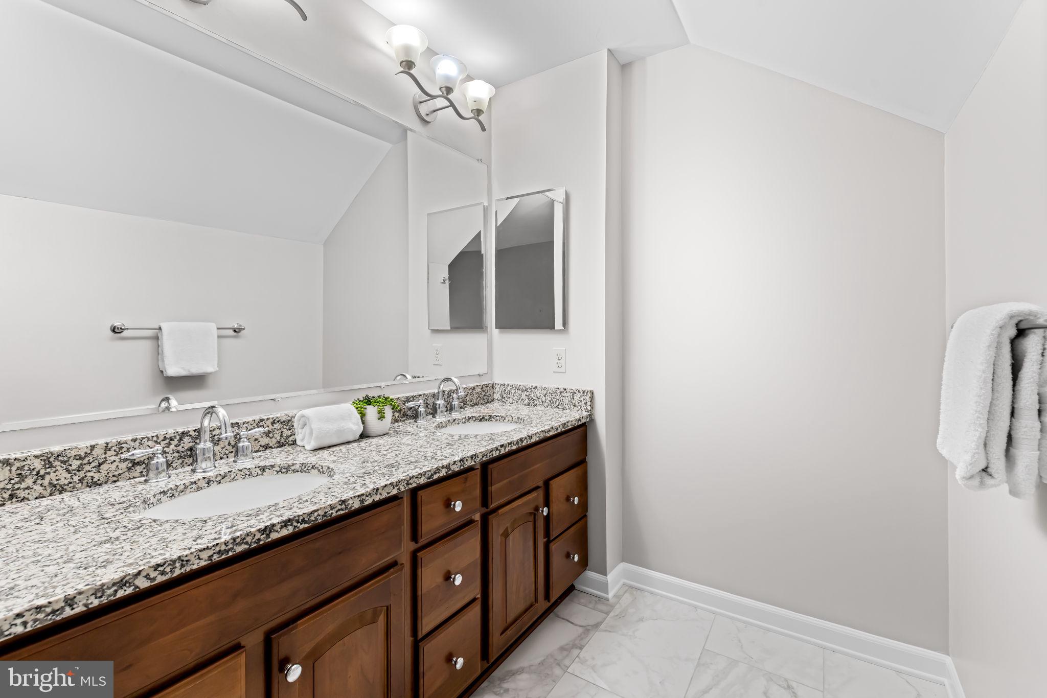 6008 Winter Grain Path Clarksville, MD 21029 - Photo 28 of 53 a bathroom with a granite countertop sink and a mirror