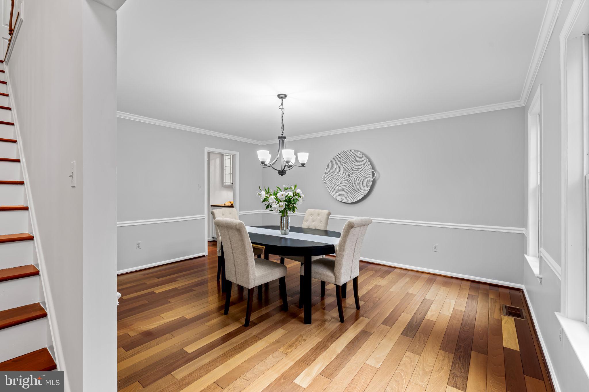 6008 Winter Grain Path Clarksville, MD 21029 - Photo 8 of 53 a view of a dining room with furniture and wooden floor