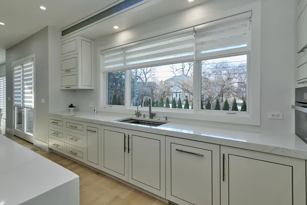 a bathroom with a toilet sink and a mirror