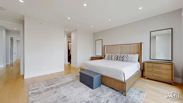 a bedroom with a bed and a walk in closet