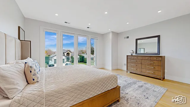 a bedroom with a bed and a dresser