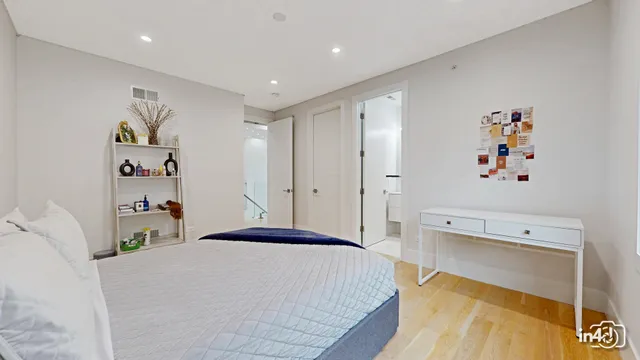 a bedroom with a bed and a couch