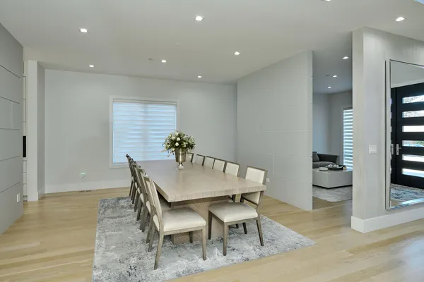 a kitchen with granite countertop white cabinets and stainless steel appliances