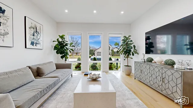 a living room with furniture and dining area