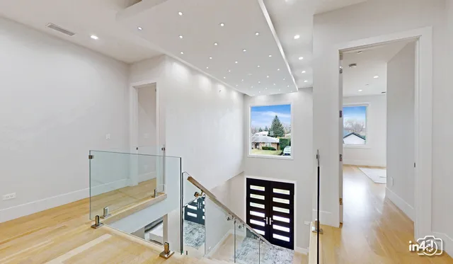 a view of an entryway with wooden floor