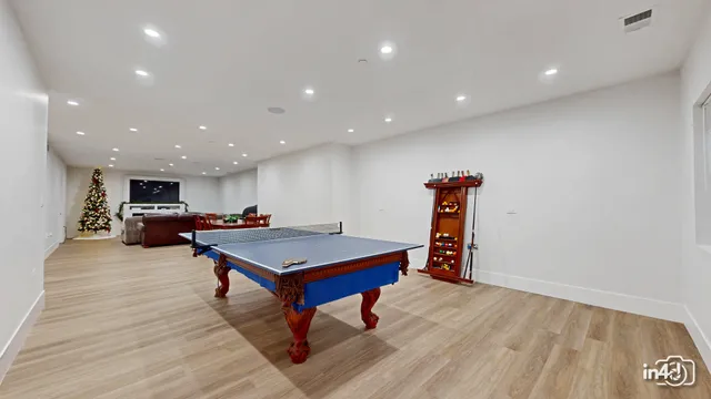 a view of an house with backyard and a patio