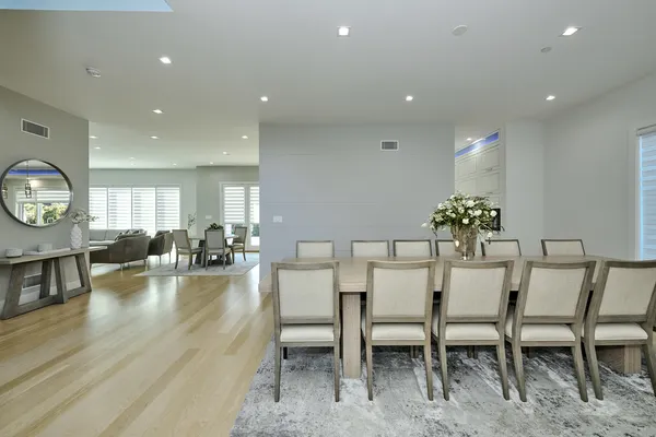 a kitchen with stainless steel appliances white cabinets and a large window