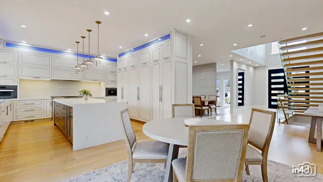 a kitchen with kitchen island a appliances and a dining table