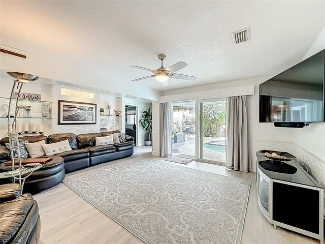 a view of a backyard with plants and a patio