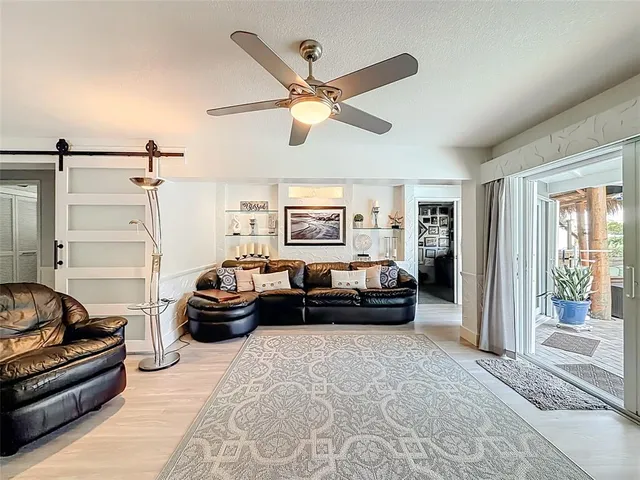 a view of a house with swimming pool and sitting area