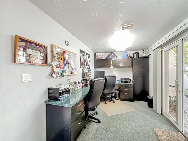 a view of a swimming pool with a patio