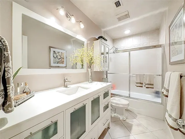 a view of a house with floor to ceiling windows and a table