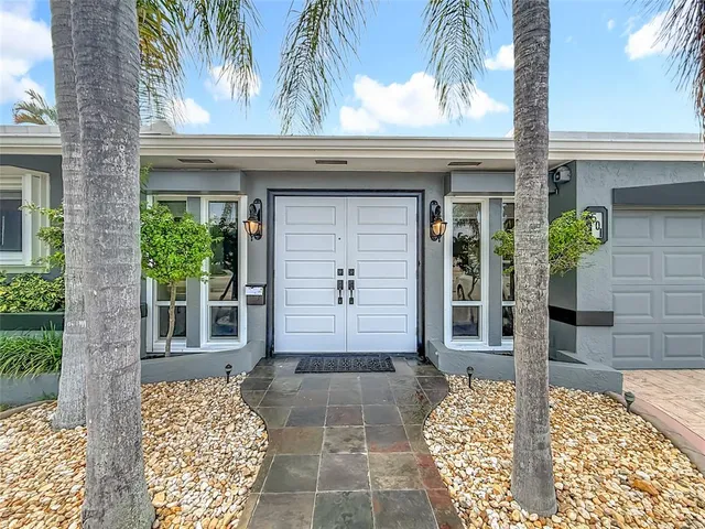a view of a livingroom with furniture and a flat screen tv