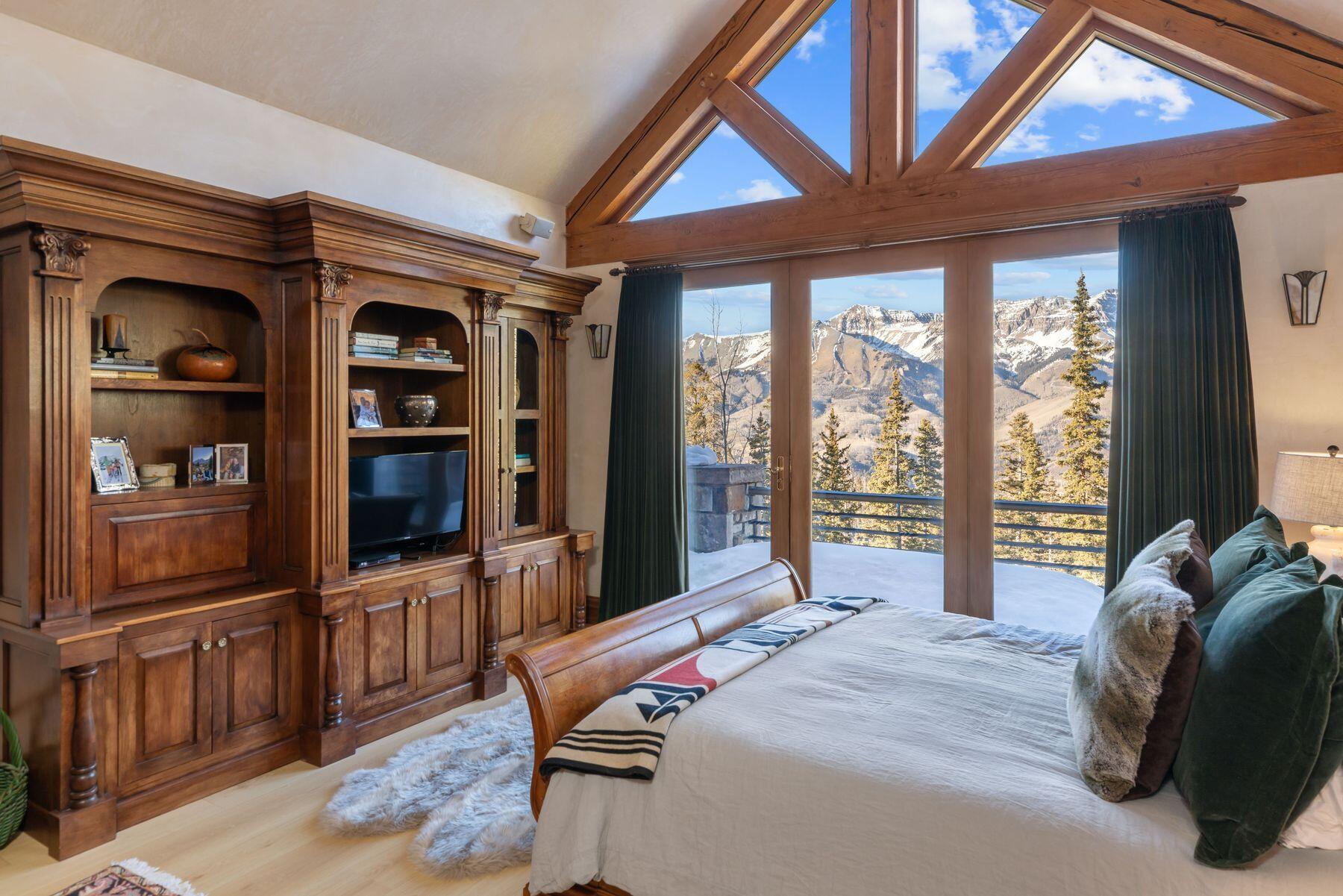 222 High Country Road Mountain Village, CO 81435 - Photo 12 of 37 a bedroom with a bed and a large window