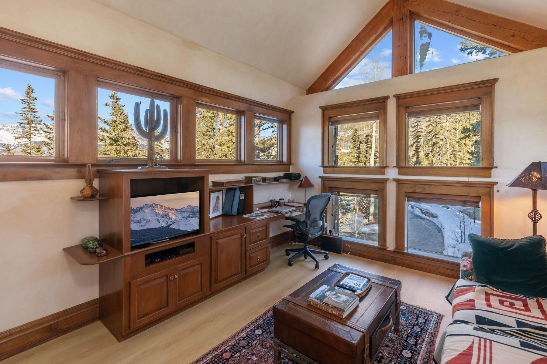 222 High Country Road Mountain Village, CO 81435 - Photo 13 of 37 a living room with furniture and a fireplace