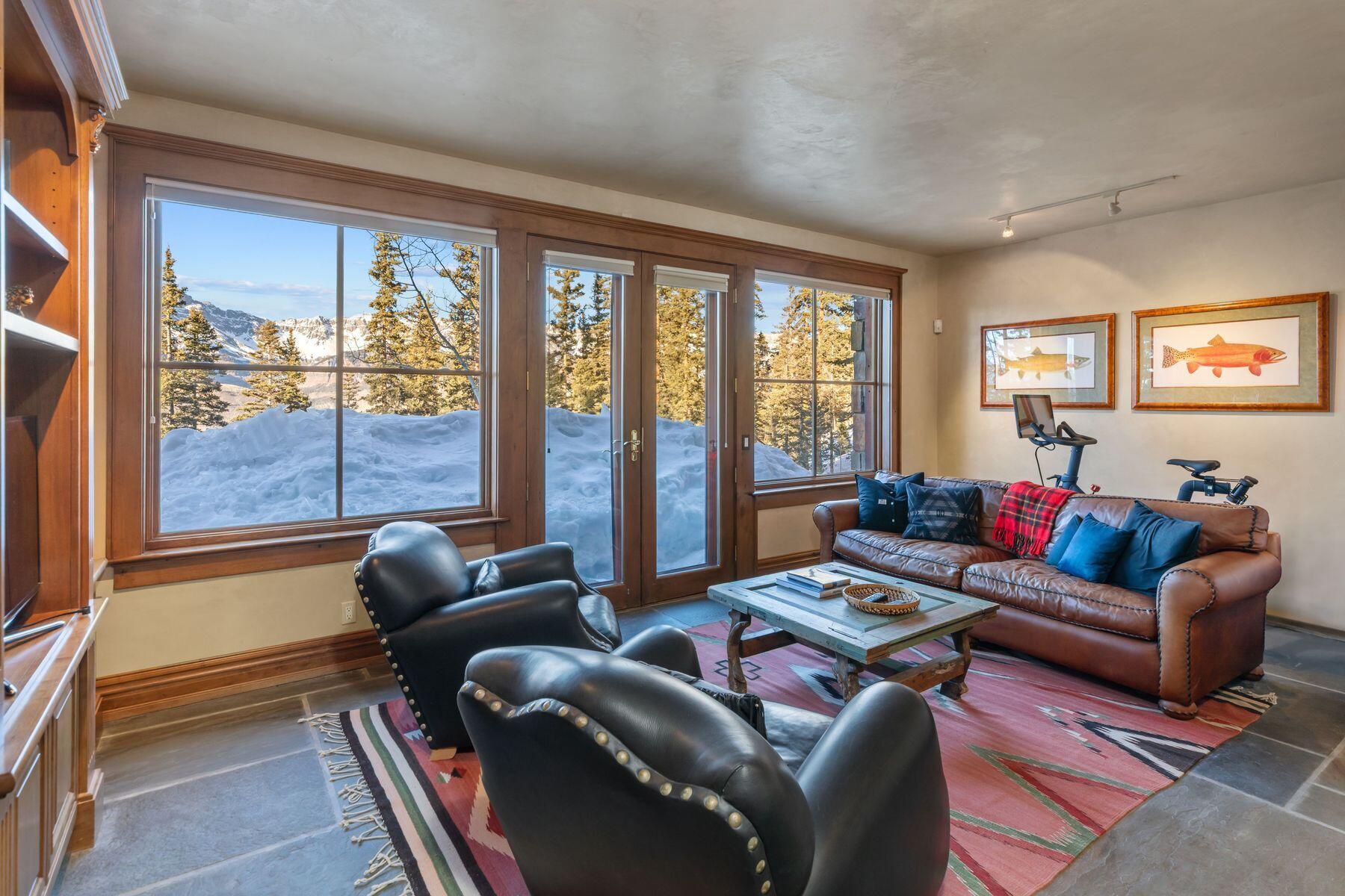 222 High Country Road Mountain Village, CO 81435 - Photo 16 of 37 a living room with furniture and a floor to ceiling window