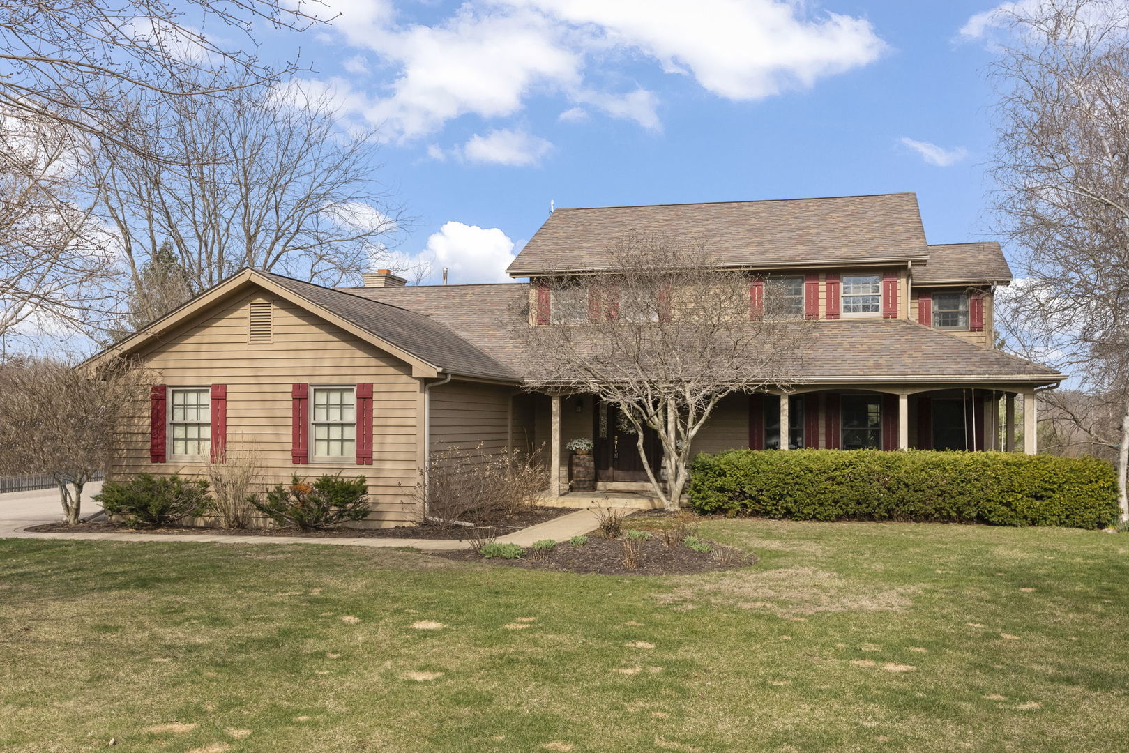 a front view of a house with garden