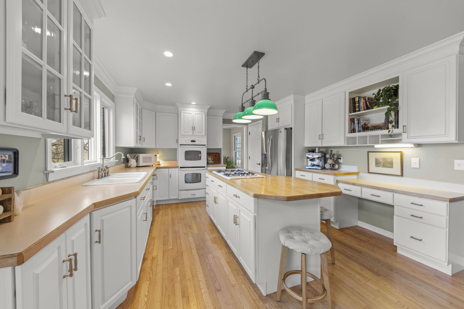 19 Shagbark Lane Newark, IL 60541 - Photo 12 of 60 a large kitchen with stainless steel appliances granite countertop a lot of counter space and wooden floors