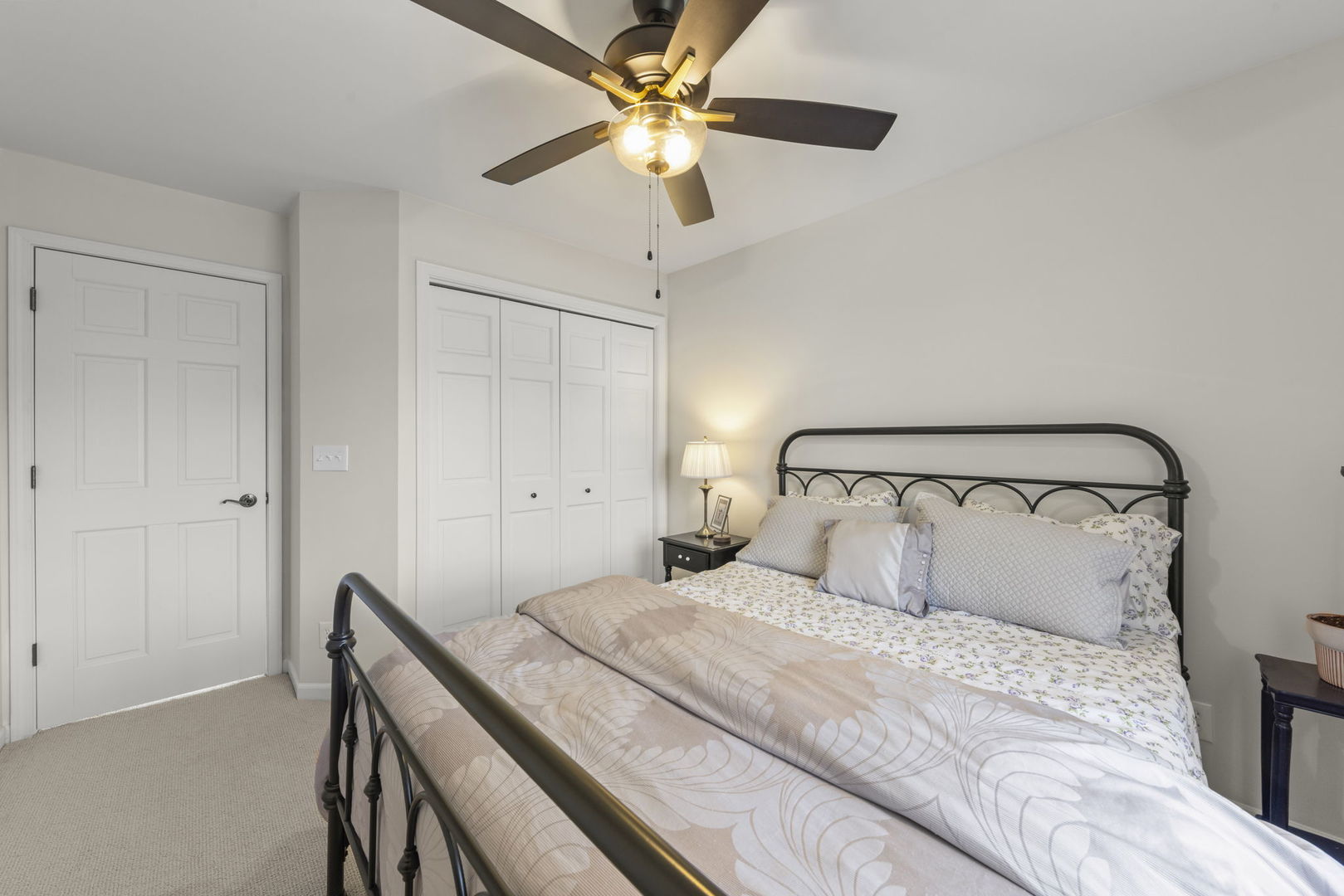 19 Shagbark Lane Newark, IL 60541 - Photo 22 of 60 a bedroom with a bed and a ceiling fan