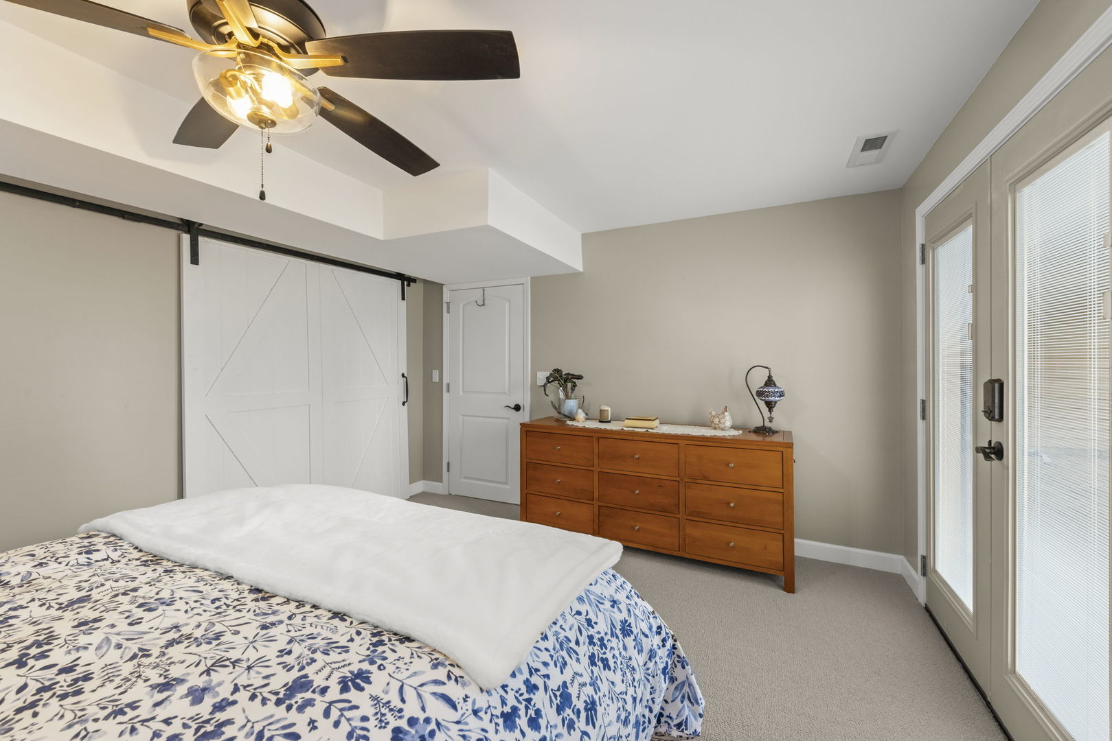 19 Shagbark Lane Newark, IL 60541 - Photo 30 of 60 a bedroom with a bed and a chandelier fan