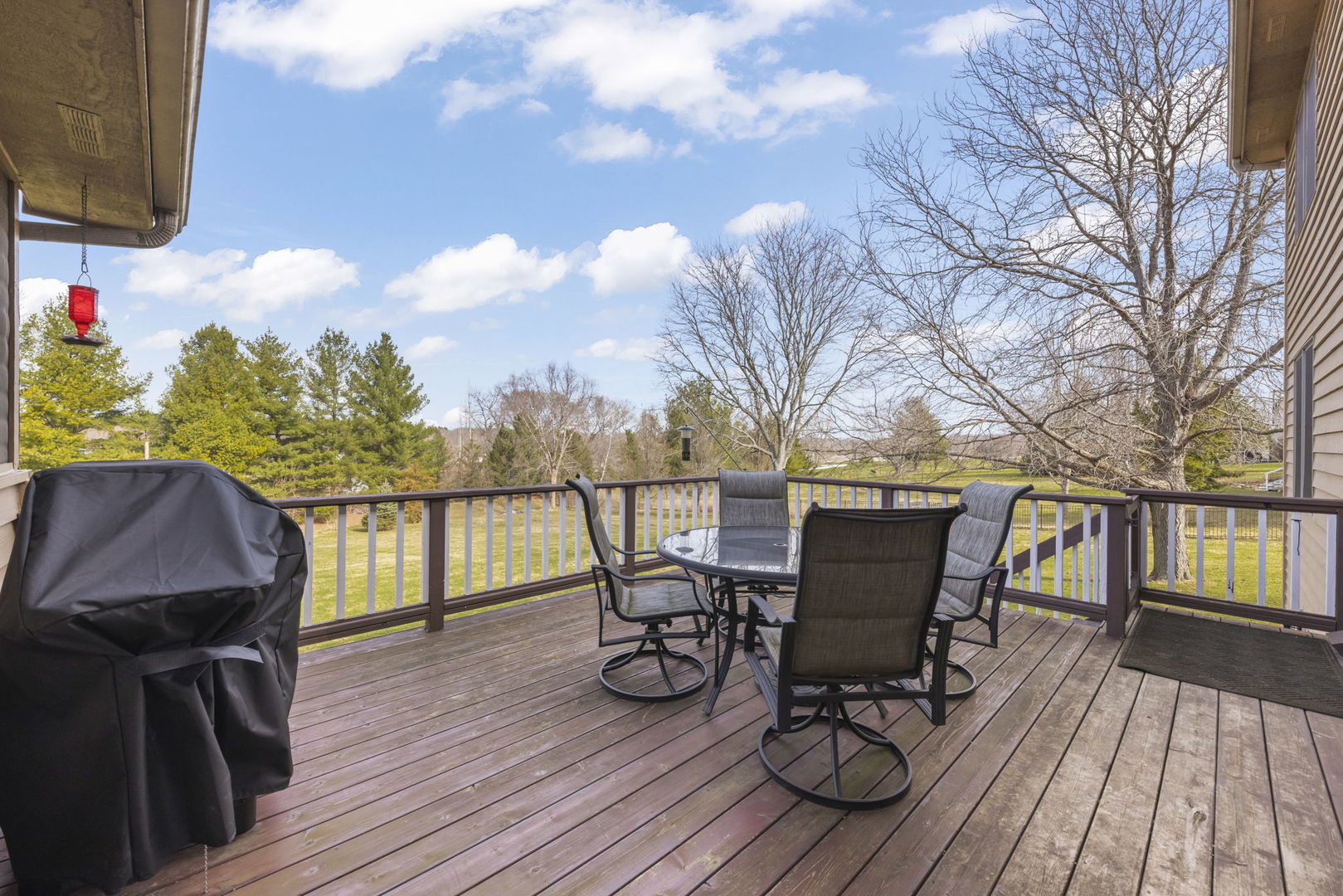 19 Shagbark Lane Newark, IL 60541 - Photo 33 of 60 a view of a deck with table and chairs and wooden floor