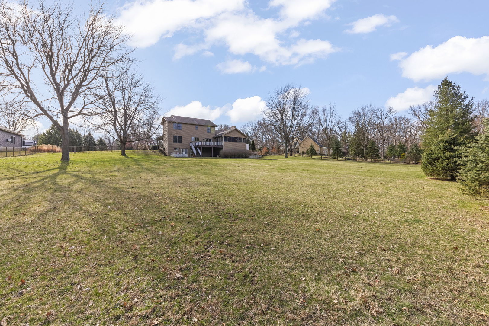 19 Shagbark Lane Newark, IL 60541 - Photo 37 of 60 a yellow house with trees in front of it