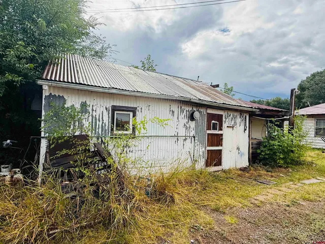 a view of a storage room with racks on the wall
