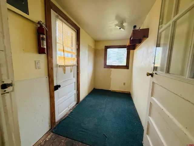 a view of a hallway with a window