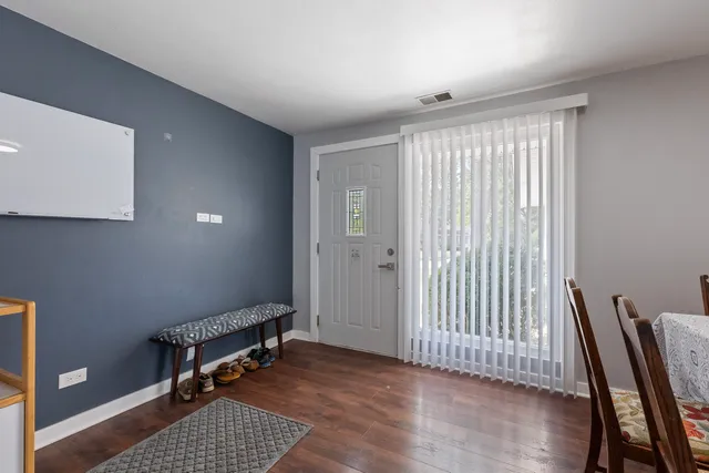 a view of room with stairs and wooden floor