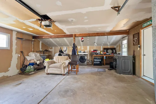 a backyard of a house with table and chairs
