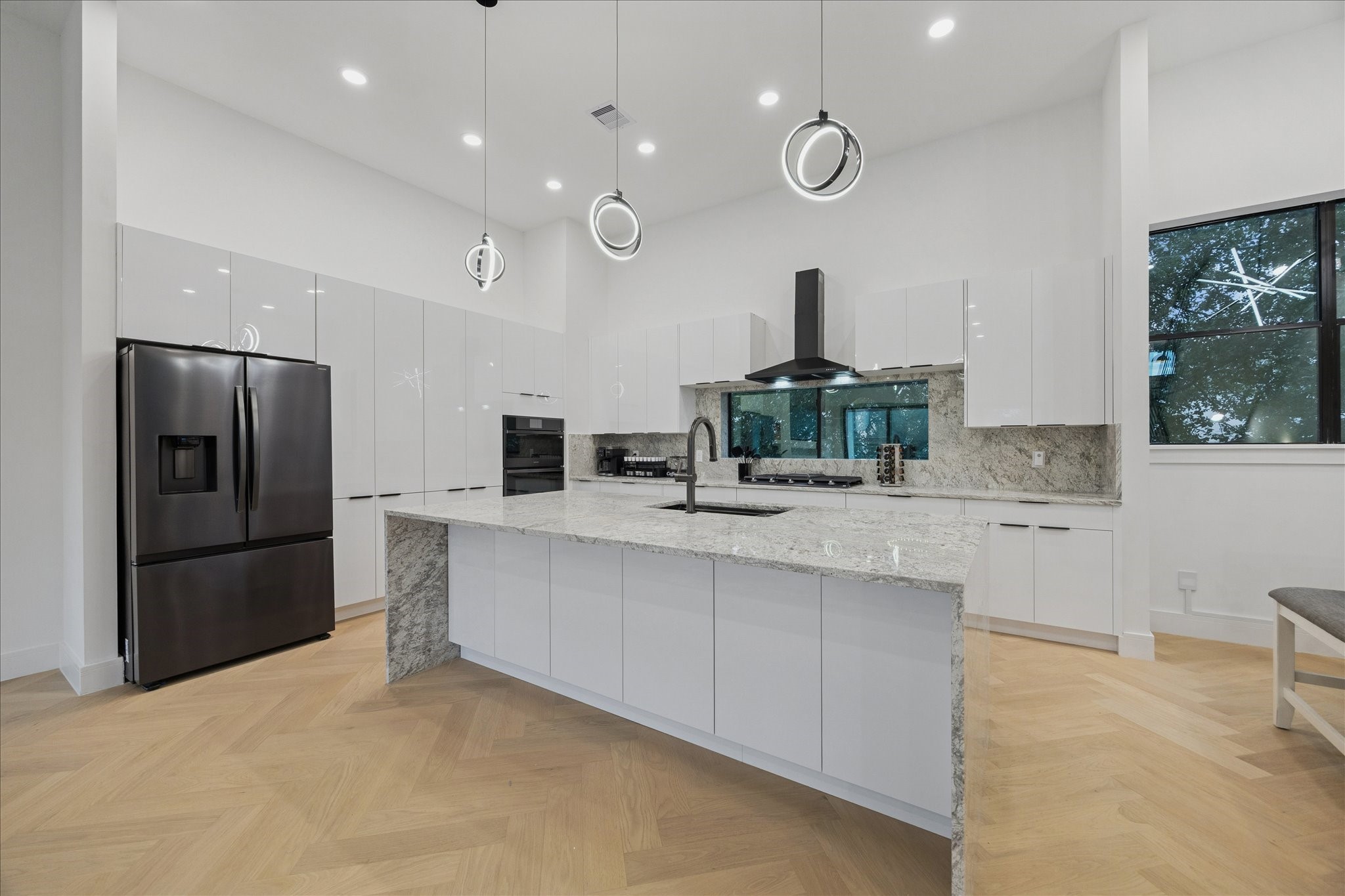 809 Memorial Heights Drive Houston, TX 77007 - Photo 15 of 32 Designed for effortless hosting, this kitchen offers generous cabinet storage, premium finishes, and a large island perfect for gathering.